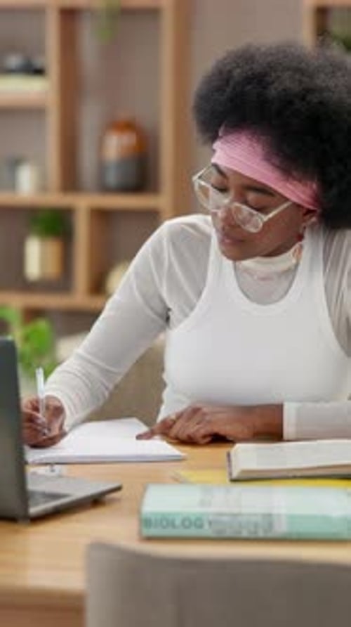 Books, laptop and writing with black woman in home office for research assignment