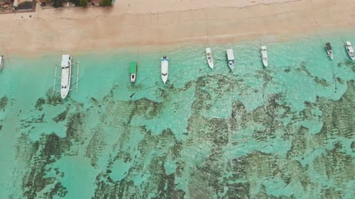 Sea Reefs Off the Coast of the Village of Lembongan with Boats on the Island of Nusa Lembongan