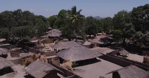 Aerial view of village with huts and trees, Mozambique.