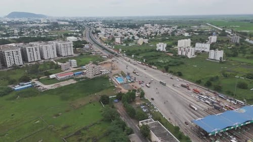 Drone shot of Vijayawada’s cityscape blending urban and natural elements.