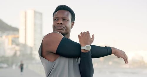 Black man, fitness or stretching with arms on promenade for workout preparation or outdoor exercise