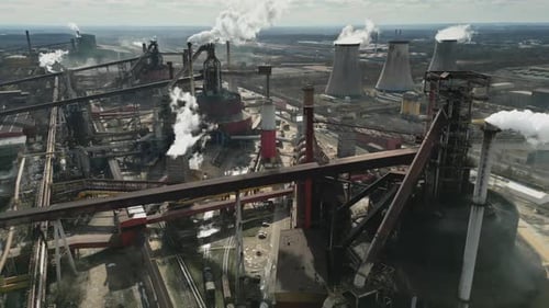 Aerial View of Large Industrial Factory with Smoke