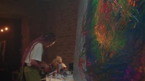 Creative Artist Painting Colorful Artwork in Studio