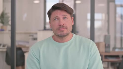 Adult Man Thinking in an Office Setting