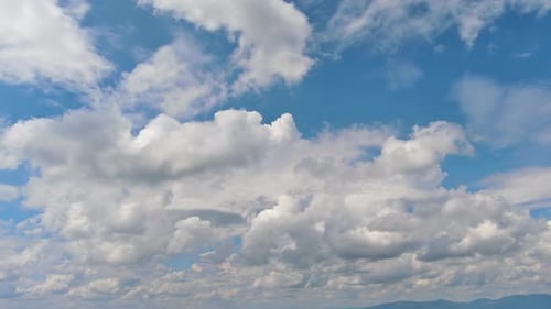 Flying Through Heavenly Fluffy Clouds Moving in Blue Sky
