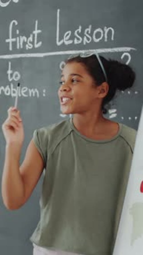 Student Reciting Geography Lesson to Teacher and her Classmates in School