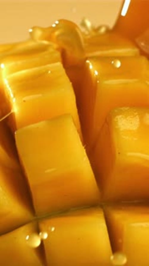 The Juice Flows Through the Sliced Mango Fruit Filmed on a Highspeed Camera at 1000 Fps