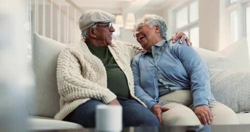 Laughing Senior Couple Relaxing Together at Home