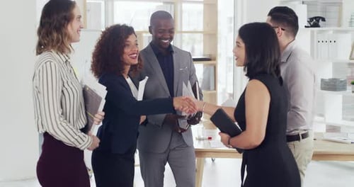 4k video footage of a group of businesspeople shaking hands in an office