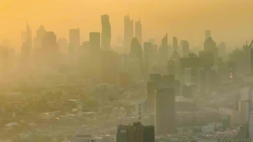 Polluted skies of urban landscapes captured from above at golden hour
