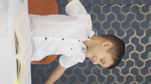 Vertical video of Happy and peaceful boy.
