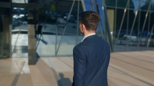 Young Stylish Man in Suit Walking with Confidence in Urban City
