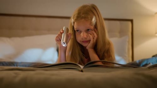 Calm Relaxed Caucasian Little Girl Child Daughter Kid Schoolgirl Reading Book Story Fairytale Hold