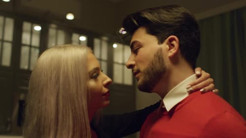 Close Up of Young Couple Embracing Tenderly Indoors