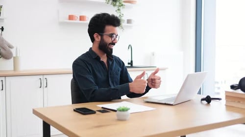 Consultant Receiving Video Call Via Computer in Home Office