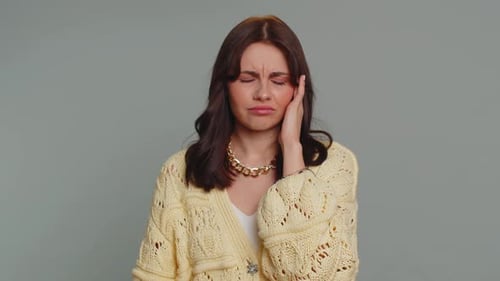 Woman Suffering Headache Rubbing Temples, Close Up