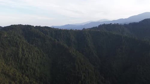 Scenic mountain landscape showcasing lush hills, open skies, and untouched natural terrain.
