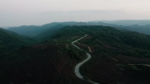 Winding Road in the Mountain at Dusk