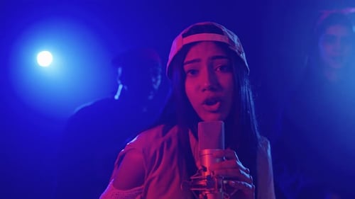 Young Singer Performing Live with Her Crew in Slow Motion