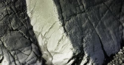 Close Up View of Textured Stone Surface Revealing Natural Patterns and Colors