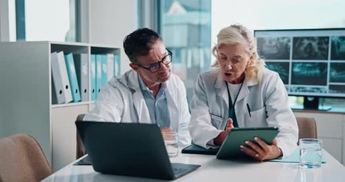 Doctors Reviewing Patient Data Using Modern Technology