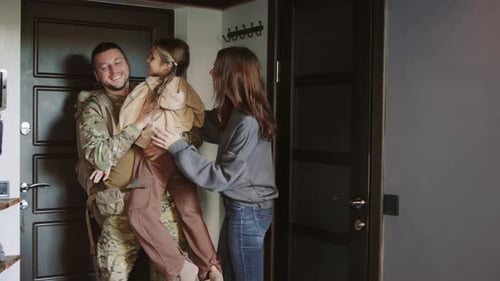 Soldier Returns Home to Loving Family Embrace