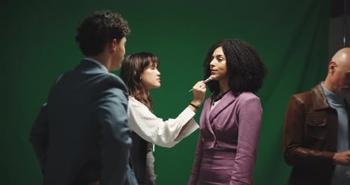 Makeup, beauty and beautician with model in studio for photoshoot, filming or production