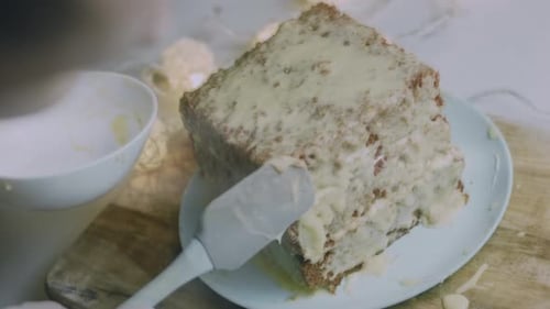 I Spread the Cream on the Square Cake Crusts Christmas Atmosphere with Lights in the Background