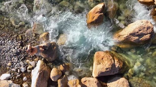 Man Athlete Practicing Playing Sports and Yoga on the Bank of the River at Sunset