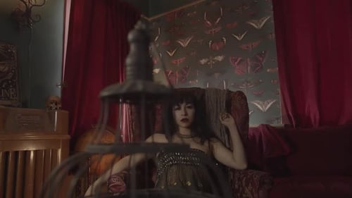 Woman Lounging in Gothic Interior