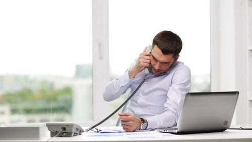 Furious hispanic businessman blaming someone on the phone about a contract in office
