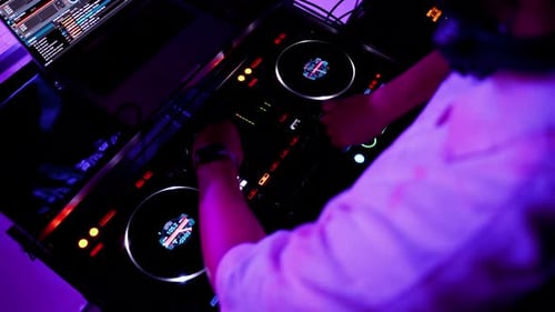 Setting Up Digital Mixing Console with Hands of DJ Top View Confident DJ Sets Up Fader on Digital