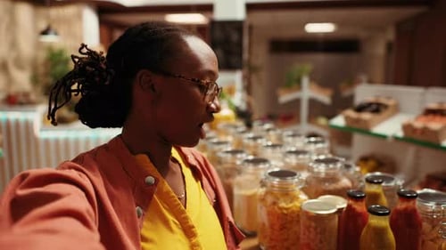 POV of African American Buyer Filming Products at Farmers Market