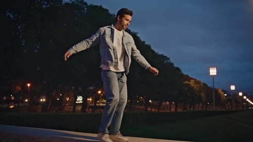 Carefree Tourist Enjoy Evening in Town Park Happy Latin Man Walking on Railings