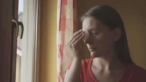 Woman Cleaning Face with Toner