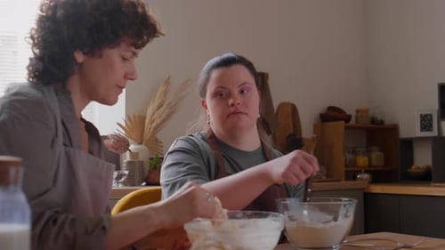 Two Women Baking Together in Kitchen