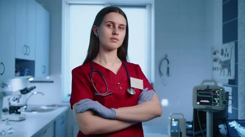 Close Up of Serious Female Vet with Crossed Hands on Chest in a Cabinet