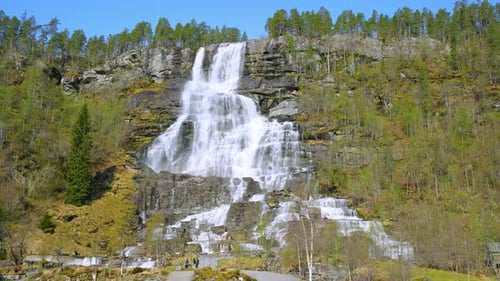 The spectacular Tvindfossen waterfall is located in sunny Voss, Norway.