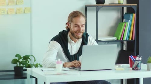 Attractive Young Man Use Laptop Video Call Speaking in Office Business Technology Handsome Work