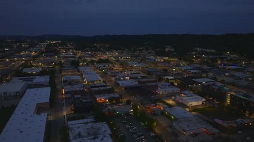 Aerial View of Low Buildings in a Medium Sized City in USA at Night Highlighting the City's Glowing