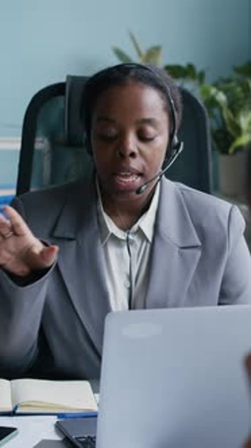 Young Operator Explaining Details of Service Providing to Online Customer