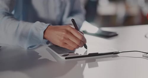 Digital Artist Drawing on Graphics Tablet With Stylus