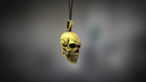 High quality close up render of a small shiny gold skull pendant, swinging slowly on the end of a ne