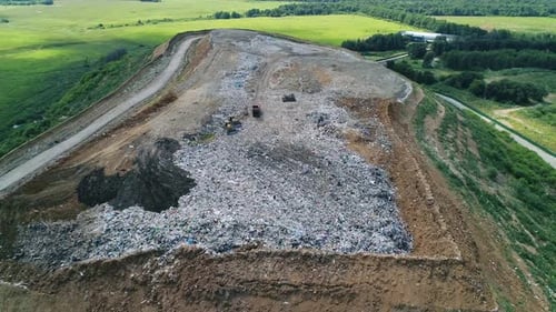 Aerial View of Large Garbage Landfill Trash Dump Flocks of Birds Circling Over the Garbage Dump