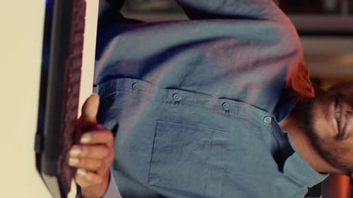 Young Man Working at Computer Late at Night