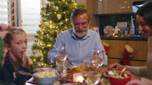 Family Together at Christmas Dinner in Home