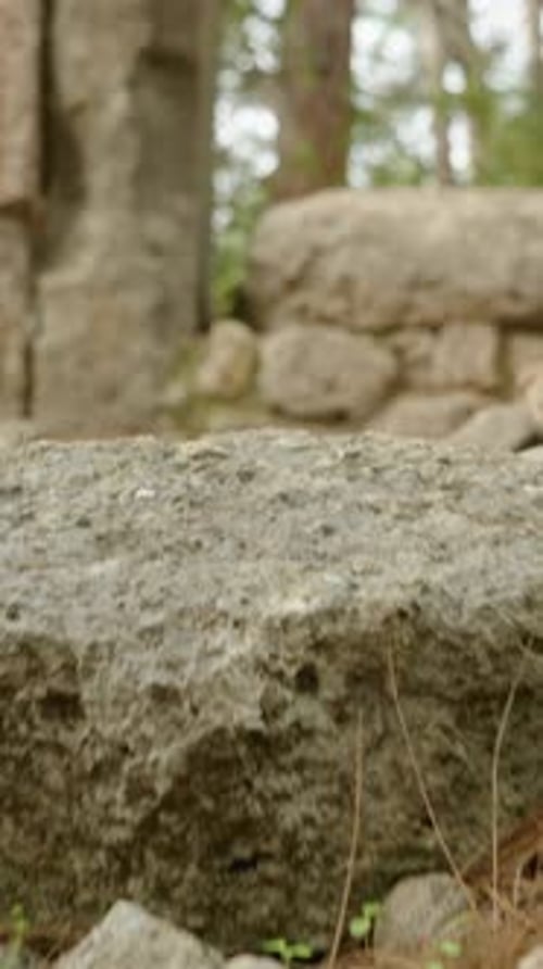 Vertical video. The ruins of the ancient city of Phaselis in ancient Lycia. I climb the steps.
