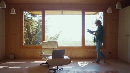 Woman Reading in Bright Modern Home