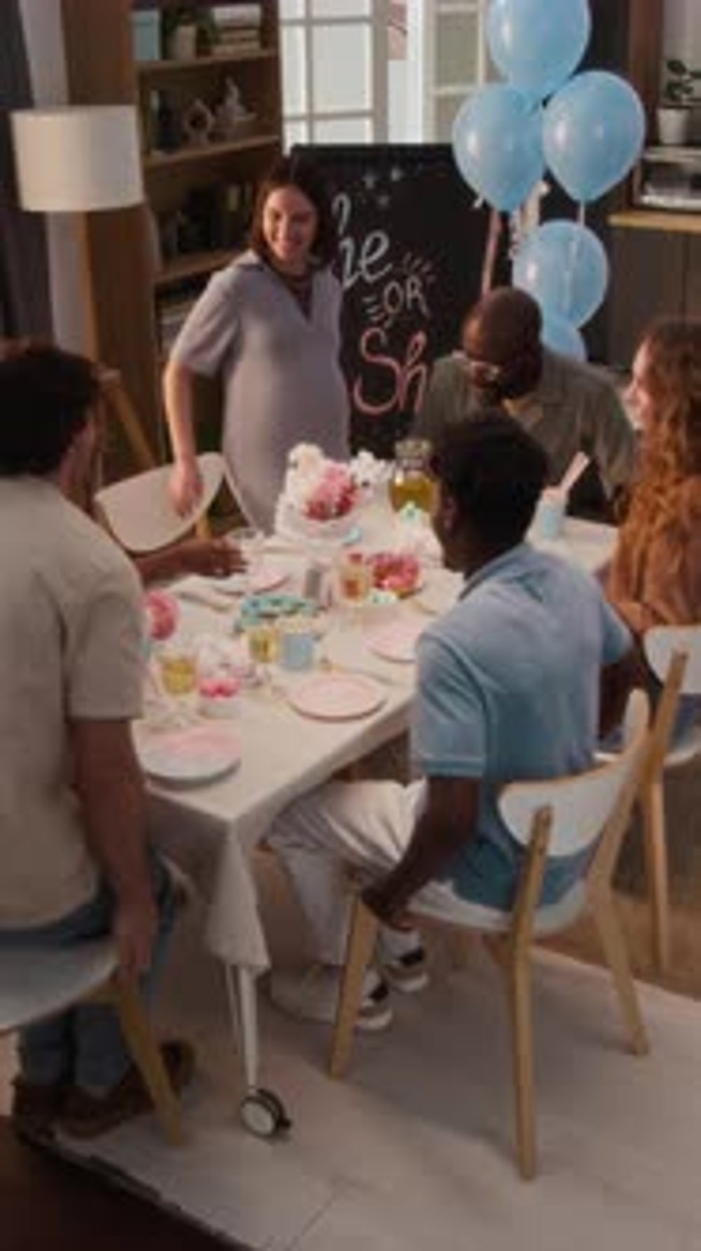 Expecting Couple and Friends Coming in Living Room Taking Seats at ...