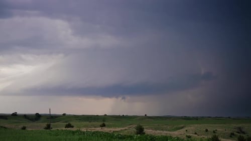 Storm Clouds and Lightning over Green Fields